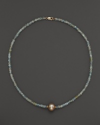 A lustrous champagne cultured freshwater pearl on a sparkling aquamarine necklace from Lara Gold for LTC. A lustrous champagne cultured freshwater pearl on a sparkling aquamarine necklace from Lara Gold for LTC.