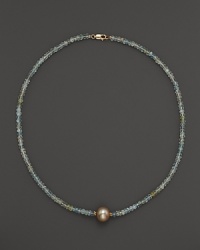 A lustrous champagne cultured freshwater pearl on a sparkling aquamarine necklace from Lara Gold for LTC.