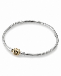 Mixed metals look chic on Pandora's sterling silver bracelet with a 14K gold signature clasp. Mixed metals look chic on Pandora's sterling silver bracelet with a 14K gold signature clasp.