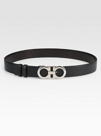 Luxurious Italian leather belt that reverses from black to brown with silvertone double Gancini buckle.Width, about 1.4Made in Italy Luxurious Italian leather belt that reverses from black to brown with silvertone double Gancini buckle.Width, about 1.4Made in Italy