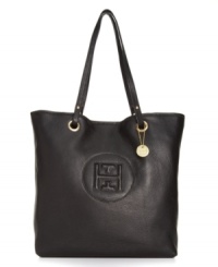 Find your signature style with this iconic design from Tommy Hilfiger. This luxe leather tote features an embossed logo at front and gorgeous polished hardware with a charm at the handle base. Find your signature style with this iconic design from Tommy Hilfiger. This luxe leather tote features an embossed logo at front and gorgeous polished hardware with a charm at the handle base.