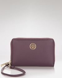 Tory Burch meets the need for wholly modern accessories. This iPhone wallet flaunts an enviably practical design with space for your gadget and pockets for the essentials. Tory Burch meets the need for wholly modern accessories. This iPhone wallet flaunts an enviably practical design with space for your gadget and pockets for the essentials.