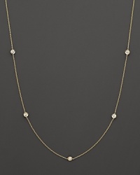 A yellow gold necklace with bezel-set diamond stations. With signature ruby accent. Designed by Roberto Coin. A yellow gold necklace with bezel-set diamond stations. With signature ruby accent. Designed by Roberto Coin.