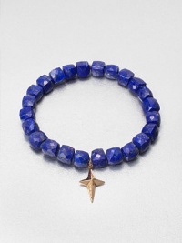 A sparkling diamond charm in 14k gold on a lapis stretch bead bracelet. Lapis14K goldDiamonds, .02 tcwLength, about 6.5Slip-on styleImported A sparkling diamond charm in 14k gold on a lapis stretch bead bracelet. Lapis14K goldDiamonds, .02 tcwLength, about 6.5Slip-on styleImported