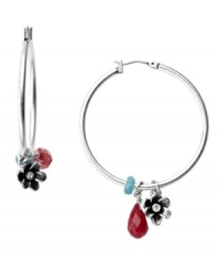 Take a turn from traditional! Fossil's trendy hoops include colored jade and epoxy accents with sculpted silver tone flower charms. Set in silver tone mixed metal. Approximate drop: 2-1/4 inches. Take a turn from traditional! Fossil's trendy hoops include colored jade and epoxy accents with sculpted silver tone flower charms. Set in silver tone mixed metal. Approximate drop: 2-1/4 inches.