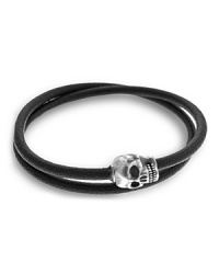 A grinning skull taps into your dark side with this wraparound bracelet from Tateossian. A grinning skull taps into your dark side with this wraparound bracelet from Tateossian.
