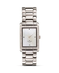 Take an uptown approach to accessorizing with this gold-plated watch from kate spade new york. It's rectangular design is city chic, while a glitzy bezel and silver band adds glamor. Take an uptown approach to accessorizing with this gold-plated watch from kate spade new york. It's rectangular design is city chic, while a glitzy bezel and silver band adds glamor.
