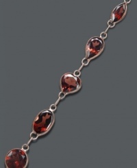 Add richness to your look in red-hot color. Oval and round-cut garnets (7-1/2 ct. t.w.) shine in a 14k gold setting. Approximate length: 7 inches. Add richness to your look in red-hot color. Oval and round-cut garnets (7-1/2 ct. t.w.) shine in a 14k gold setting. Approximate length: 7 inches.