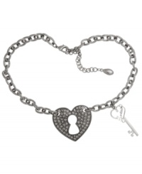 Open your heart. GUESS' heart lock and key necklace lets you reveal your romantic side. With glittering glass accents, it's crafted in a combination of hematite tone and silver tone mixed metal. Approximate length: 15 inches + 2-inch extender. Approximate drop: 1/2 inch.