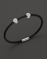 From the Celtic Noir Collection, a stackable bangle in white gold and black PVD cable with diamond stations. Designed by Charriol. From the Celtic Noir Collection, a stackable bangle in white gold and black PVD cable with diamond stations. Designed by Charriol.