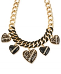 Wild at heart. This frontal necklace from Betsey Johnson is crafted from gold-tone mixed metal with with glass crystal and leopard print adorning black heart stones for a bit of animal attraction. Approximate length: 15 inches + 3-inch extender. Approximate frontal drop: 2-1/2 inches. Approximate heart drop: 1-3/4 inches. Wild at heart. This frontal necklace from Betsey Johnson is crafted from gold-tone mixed metal with with glass crystal and leopard print adorning black heart stones for a bit of animal attraction. Approximate length: 15 inches + 3-inch extender. Approximate frontal drop: 2-1/2 inches. Approximate heart drop: 1-3/4 inches.