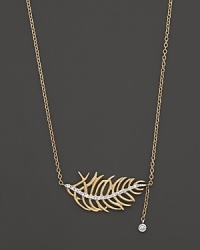 Diamonds add sparkle to a 14K yellow gold leaf. By Meira T. Diamonds add sparkle to a 14K yellow gold leaf. By Meira T.