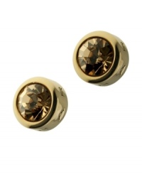 With their rich amber hue, the Colorado crystals in T Tahari's stylish stud earrings are complemented by gold tone mixed metal. Including a bezel setting and logo-embossed design. Approximate diameter: 1/2 inch. With their rich amber hue, the Colorado crystals in T Tahari's stylish stud earrings are complemented by gold tone mixed metal. Including a bezel setting and logo-embossed design. Approximate diameter: 1/2 inch.