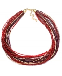 Berry beautiful! Rich red and purple hues set apart this chic collar necklace from c.A.K.e. by Ali Khan, making it a stylish fashion statement for fall. Adorned with an intricate array of seed beads and faceted glass rondelle accents, it's crafted in gold tone mixed metal. Approximate length: 16 inches + 3-inch extender. Berry beautiful! Rich red and purple hues set apart this chic collar necklace from c.A.K.e. by Ali Khan, making it a stylish fashion statement for fall. Adorned with an intricate array of seed beads and faceted glass rondelle accents, it's crafted in gold tone mixed metal. Approximate length: 16 inches + 3-inch extender.