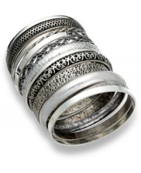 Bar III's industrial-cool bangle set features 13 separate bangles. Includes a chic mix of burnished silver tone with varying textures. Crafted in burnish copper-plated mixed metal. Approximate diameter: 2-1/2 inches. Bar III's industrial-cool bangle set features 13 separate bangles. Includes a chic mix of burnished silver tone with varying textures. Crafted in burnish copper-plated mixed metal. Approximate diameter: 2-1/2 inches.