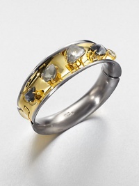 From the Miss Havisham Collection. Golden on the outside, gunmetal on the inside, this striking bangle is dotted with chunky doublets in dramatic tendril-like settings.CrystalWhite quartz, hematite and pyriteGoldtone and ruthenium platingDiameter, about 2.1Width, about .9Hinged, with magnetic closureMade in USA From the Miss Havisham Collection. Golden on the outside, gunmetal on the inside, this striking bangle is dotted with chunky doublets in dramatic tendril-like settings.CrystalWhite quartz, hematite and pyriteGoldtone and ruthenium platingDiameter, about 2.1Width, about .9Hinged, with magnetic closureMade in USA