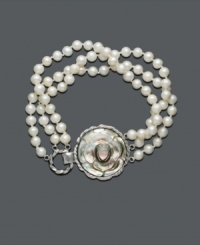 Make a modern statement with a nontraditional take on the classic pearl bracelet. Three strands of luminous cultured freshwater pearl (5-1/2 - 6 mm) anchor to a circular sterling silver and mother-of-pearl pendant. Approximate length: 8 inches. Make a modern statement with a nontraditional take on the classic pearl bracelet. Three strands of luminous cultured freshwater pearl (5-1/2 - 6 mm) anchor to a circular sterling silver and mother-of-pearl pendant. Approximate length: 8 inches.