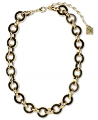 Link together haute fashion. This chunky collar necklace from Anne Klein flaunts jet enamel links for an intriguing look. Crafted in gold tone mixed metal. Approximate length: 16 inches + 3-inch extender. Link together haute fashion. This chunky collar necklace from Anne Klein flaunts jet enamel links for an intriguing look. Crafted in gold tone mixed metal. Approximate length: 16 inches + 3-inch extender.