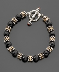 A dramatic accent for any occasion, this bracelet features black onyx stones (8.5-9mm) surrounded by sterling silver beads and 14k gold accents. Measures 8 long. A dramatic accent for any occasion, this bracelet features black onyx stones (8.5-9mm) surrounded by sterling silver beads and 14k gold accents. Measures 8 long.