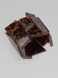 Glossy, geometric tortoise panels make for a serious statement piece.HornCircumference, about 7¼Width, about 2½Slip-on styleImported Glossy, geometric tortoise panels make for a serious statement piece.HornCircumference, about 7¼Width, about 2½Slip-on styleImported