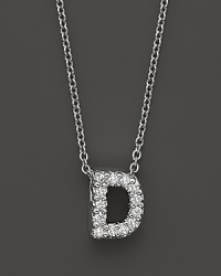 From the Tiny Treasures collection, a diamond D necklace. With signature ruby accent. Designed by Roberto Coin. From the Tiny Treasures collection, a diamond D necklace. With signature ruby accent. Designed by Roberto Coin.