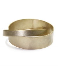 Lock in fabulous style with Jones New York's interlocked bangle. Bracelet crafted from two bands of gold-plated mixed metal. Approximate diameter: 2-3/4 inches. Lock in fabulous style with Jones New York's interlocked bangle. Bracelet crafted from two bands of gold-plated mixed metal. Approximate diameter: 2-3/4 inches.