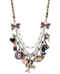 The reel deal. Betsey Johnson takes you to the movies with this frontal statement necklace. Crafted from gold-tone mixed metal and grosgrain ribbon, the necklace screams Action! with a number of glass accent charms. Approximate length: 16 inches + 3-inch extender. Approximate drop: 2-3/4 inches. The reel deal. Betsey Johnson takes you to the movies with this frontal statement necklace. Crafted from gold-tone mixed metal and grosgrain ribbon, the necklace screams Action! with a number of glass accent charms. Approximate length: 16 inches + 3-inch extender. Approximate drop: 2-3/4 inches.