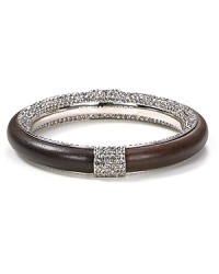 MICHAEL Michael Kors' bangle boasts intriguing contrast with smooth wood and shimmering pavé. Slide on the mixed-media bracelet for artful allure at your wrist. MICHAEL Michael Kors' bangle boasts intriguing contrast with smooth wood and shimmering pavé. Slide on the mixed-media bracelet for artful allure at your wrist.