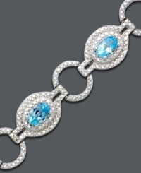 Icy ovals and glittering gemstones link up for a dazzling effect. Bracelet crafted in sterling silver features oval-cut blue topaz (4-3/4 ct. t.w.) and diamond accents. Approximate length: 7 inches. Icy ovals and glittering gemstones link up for a dazzling effect. Bracelet crafted in sterling silver features oval-cut blue topaz (4-3/4 ct. t.w.) and diamond accents. Approximate length: 7 inches.