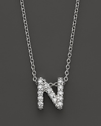 From the Tiny Treasures collection, a diamond N necklace. With signature ruby accent. Designed by Roberto Coin. From the Tiny Treasures collection, a diamond N necklace. With signature ruby accent. Designed by Roberto Coin.