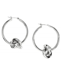 Tie your look together. These classy hoop earrings from AK Anne Klein add a twist with chic knot detail. Crafted in imitation rhodium-plated mixed metal. Approximate diameter: 1 inches. Tie your look together. These classy hoop earrings from AK Anne Klein add a twist with chic knot detail. Crafted in imitation rhodium-plated mixed metal. Approximate diameter: 1 inches.