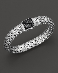 Large signature sterling woven chain bracelet with carved chain black sapphire clasp, designed by John Hardy. Large signature sterling woven chain bracelet with carved chain black sapphire clasp, designed by John Hardy.