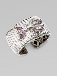 A substantial textural cuff adorned with a bird encrusted in amethyst, rhodolite and Swiss blue topaz. Sterling silver Amethyst Rhodolite Swiss blue topaz Kick mechanism closure Diameter, about 2½ Width, about 1½ Imported A substantial textural cuff adorned with a bird encrusted in amethyst, rhodolite and Swiss blue topaz. Sterling silver Amethyst Rhodolite Swiss blue topaz Kick mechanism closure Diameter, about 2½ Width, about 1½ Imported