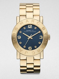 A radiant goldtone ion-plated stainless steel timepiece with a boldly color dial and rhinestone markers. Quartz movementWater resistant to 5 ATMRound goldtone ion-plated stainless steel case, 36mm (1.4)Logo engraved bezelNavy dialRhinestone and numeric hour markersSecond hand Goldtone ion-plated stainless steel link braceletImported A radiant goldtone ion-plated stainless steel timepiece with a boldly color dial and rhinestone markers. Quartz movementWater resistant to 5 ATMRound goldtone ion-plated stainless steel case, 36mm (1.4)Logo engraved bezelNavy dialRhinestone and numeric hour markersSecond hand Goldtone ion-plated stainless steel link braceletImported