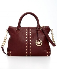 Elegance with attitude, this classic silhouette from MICHAEL Michael Kors is outfitted with golden stud accents and signature hardware. Crafted from butter-soft leather with a pocket-trimmed interior, it's the perfect go-to accessory of the season. Elegance with attitude, this classic silhouette from MICHAEL Michael Kors is outfitted with golden stud accents and signature hardware. Crafted from butter-soft leather with a pocket-trimmed interior, it's the perfect go-to accessory of the season.