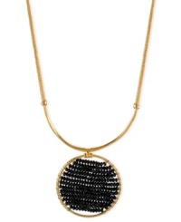 Center of attention. Kenneth Cole New York takes a circular path to style with this necklace. Crafted from gold-tone mixed metal, the pendant stands out with black cherry beads in the middle. Approximate length: 16 inches + 3-inch extender. Approximate drop: 2-1/4 inches. Center of attention. Kenneth Cole New York takes a circular path to style with this necklace. Crafted from gold-tone mixed metal, the pendant stands out with black cherry beads in the middle. Approximate length: 16 inches + 3-inch extender. Approximate drop: 2-1/4 inches.