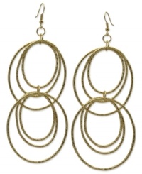 Ring in sophisticated style with GUESS. These multi-hoop earrings are crafted in gold tone mixed metal with textured detail. Approximate drop: 4 inches. Approximate diameter: 1-3/4 inches. Ring in sophisticated style with GUESS. These multi-hoop earrings are crafted in gold tone mixed metal with textured detail. Approximate drop: 4 inches. Approximate diameter: 1-3/4 inches.