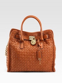 Luxurious leather in a beautiful woven pattern accented with a logo lock detail, perfect for all your daily essentials.Double top handles, 4½ dropChain shoulder strap, 10½ dropMagnetic snap closureProtective metal feetOne inside zip pocketFour inside open pocketsFully lined14W X 13H X 5¾DImported Luxurious leather in a beautiful woven pattern accented with a logo lock detail, perfect for all your daily essentials.Double top handles, 4½ dropChain shoulder strap, 10½ dropMagnetic snap closureProtective metal feetOne inside zip pocketFour inside open pocketsFully lined14W X 13H X 5¾DImported