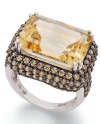 Add a touch of sunshine. This stunning sterling silver ring highlights a rectangular-cut citrine (8-1/2 ct. t.w.) and a halo of round-cut yellow Swarovski zirconias (3-1/4 ct. t.w.). Size 7. Add a touch of sunshine. This stunning sterling silver ring highlights a rectangular-cut citrine (8-1/2 ct. t.w.) and a halo of round-cut yellow Swarovski zirconias (3-1/4 ct. t.w.). Size 7.