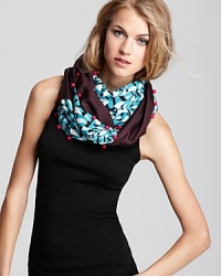 The hanging buttons and colorful print of DIANE von FURSTENBERG's circle scarf embody everything we love about this iconic designer. The hanging buttons and colorful print of DIANE von FURSTENBERG's circle scarf embody everything we love about this iconic designer.