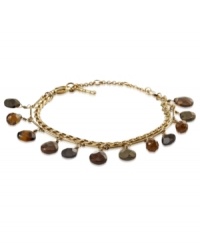 Fossil puts the accent on style with this dual-chain bracelet. Semi-precious accents find a home on the gold-tone mixed metal bracelet with a lobster-claw closure. Approximate length: 7-1/2 inches + 1-1/2-inch extender. Fossil puts the accent on style with this dual-chain bracelet. Semi-precious accents find a home on the gold-tone mixed metal bracelet with a lobster-claw closure. Approximate length: 7-1/2 inches + 1-1/2-inch extender.