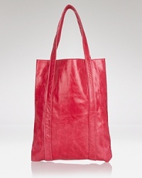 Long and lean, Dewdrop's tawny leather tote keeps must haves ready to go. Shoulder it anytime--the smooth style is perfect for errand-running and weekend trips. Long and lean, Dewdrop's tawny leather tote keeps must haves ready to go. Shoulder it anytime--the smooth style is perfect for errand-running and weekend trips.