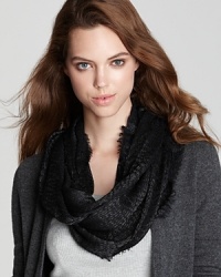 Dazzling day or night, Echo's sparkly circle scarf adds radiance to solid sweaters and coats. Dazzling day or night, Echo's sparkly circle scarf adds radiance to solid sweaters and coats.