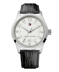 Timeless design with classic appeal, by Tommy Hilfiger. Watch crafted from black croc-embossed leather strap and round silvertone mixed metal case. Textured silvertone dial features applied numerals, date window at six o'clock and iconic flag logo. Quartz movement. Water resistant to 30 meters. Ten-year limited warranty. Timeless design with classic appeal, by Tommy Hilfiger. Watch crafted from black croc-embossed leather strap and round silvertone mixed metal case. Textured silvertone dial features applied numerals, date window at six o'clock and iconic flag logo. Quartz movement. Water resistant to 30 meters. Ten-year limited warranty.