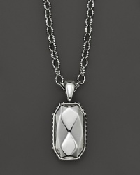 Faceted sterling silver makes a striking statement on a link chain. Faceted sterling silver makes a striking statement on a link chain.