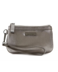 Grab the wristlet purse by Calvin Klein to carry just the essentials or stash within handy reach inside a larger bag. Grab the wristlet purse by Calvin Klein to carry just the essentials or stash within handy reach inside a larger bag.