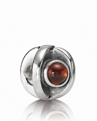 A sterling silver eye charm with garnet iris adds a blink of color to your PANDORA bracelet. A sterling silver eye charm with garnet iris adds a blink of color to your PANDORA bracelet.