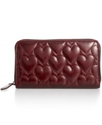 A shining example of effortless organization, this Betsey Johnson wallet adds glossy-glamour to the everyday. Pocked-lined and adorned with a sweet heart-embossed pattern, it's sized-right to slip into almost any handbag. A shining example of effortless organization, this Betsey Johnson wallet adds glossy-glamour to the everyday. Pocked-lined and adorned with a sweet heart-embossed pattern, it's sized-right to slip into almost any handbag.