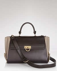 Rich, tonal leathers on this Salvatore Ferragamo satchel instantly update this forever-luxurious carryall. Rich, tonal leathers on this Salvatore Ferragamo satchel instantly update this forever-luxurious carryall.