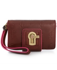 Tech it out! This wrislet from Juicy Couture works overtime as a wallet and tech case in one. Crafted from supple signature-embossed leather with a charming turn lock closure, it boasts plenty of interior compartments for iPhone, headphones, cash, cards, whatever. Tech it out! This wrislet from Juicy Couture works overtime as a wallet and tech case in one. Crafted from supple signature-embossed leather with a charming turn lock closure, it boasts plenty of interior compartments for iPhone, headphones, cash, cards, whatever.